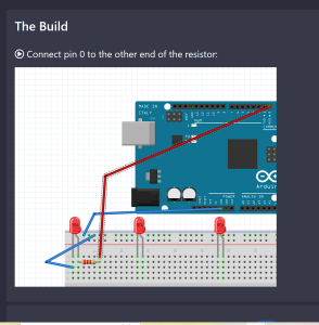 students in front of wall with instructor